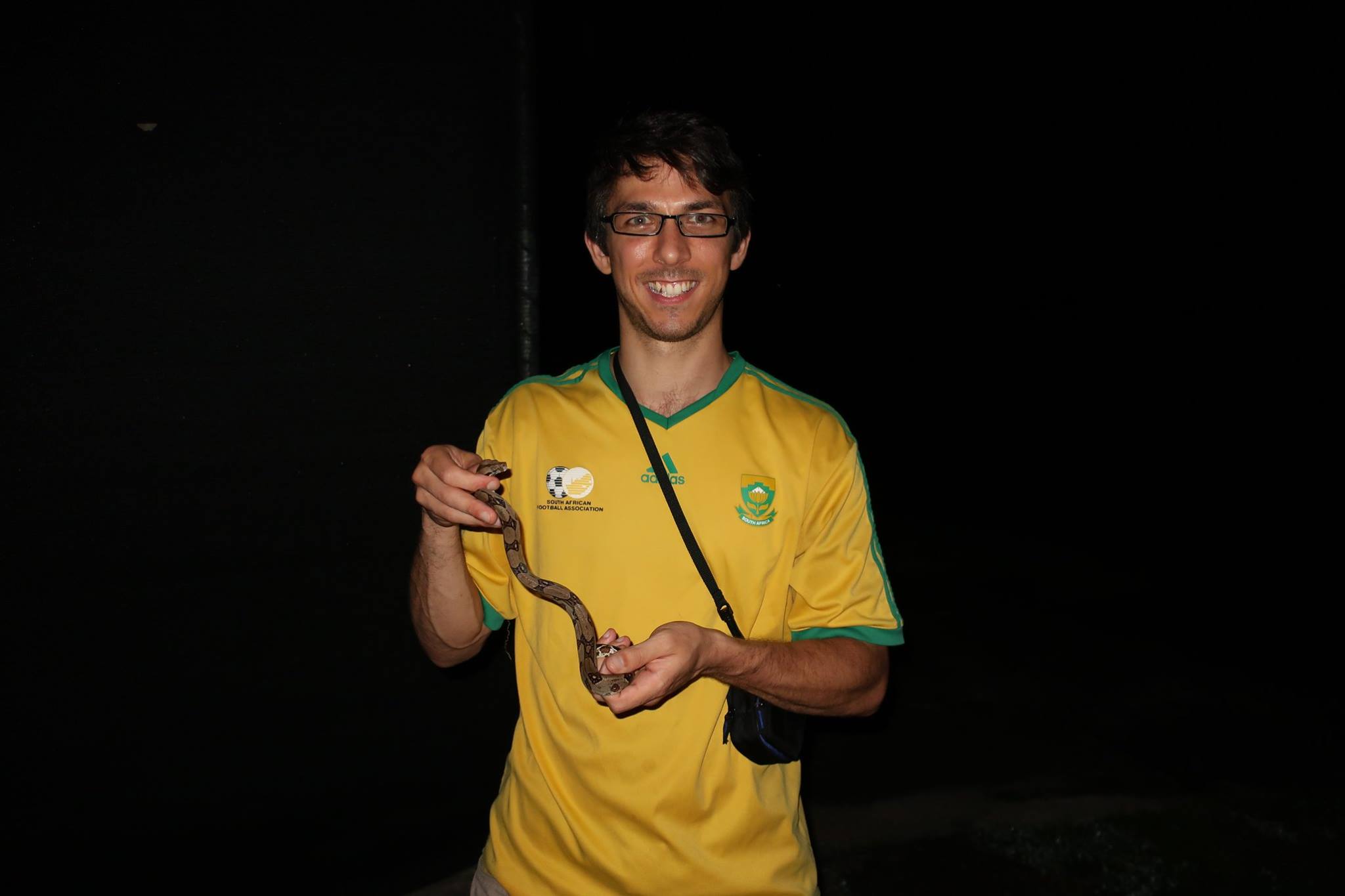 Profile image: man holding a snake